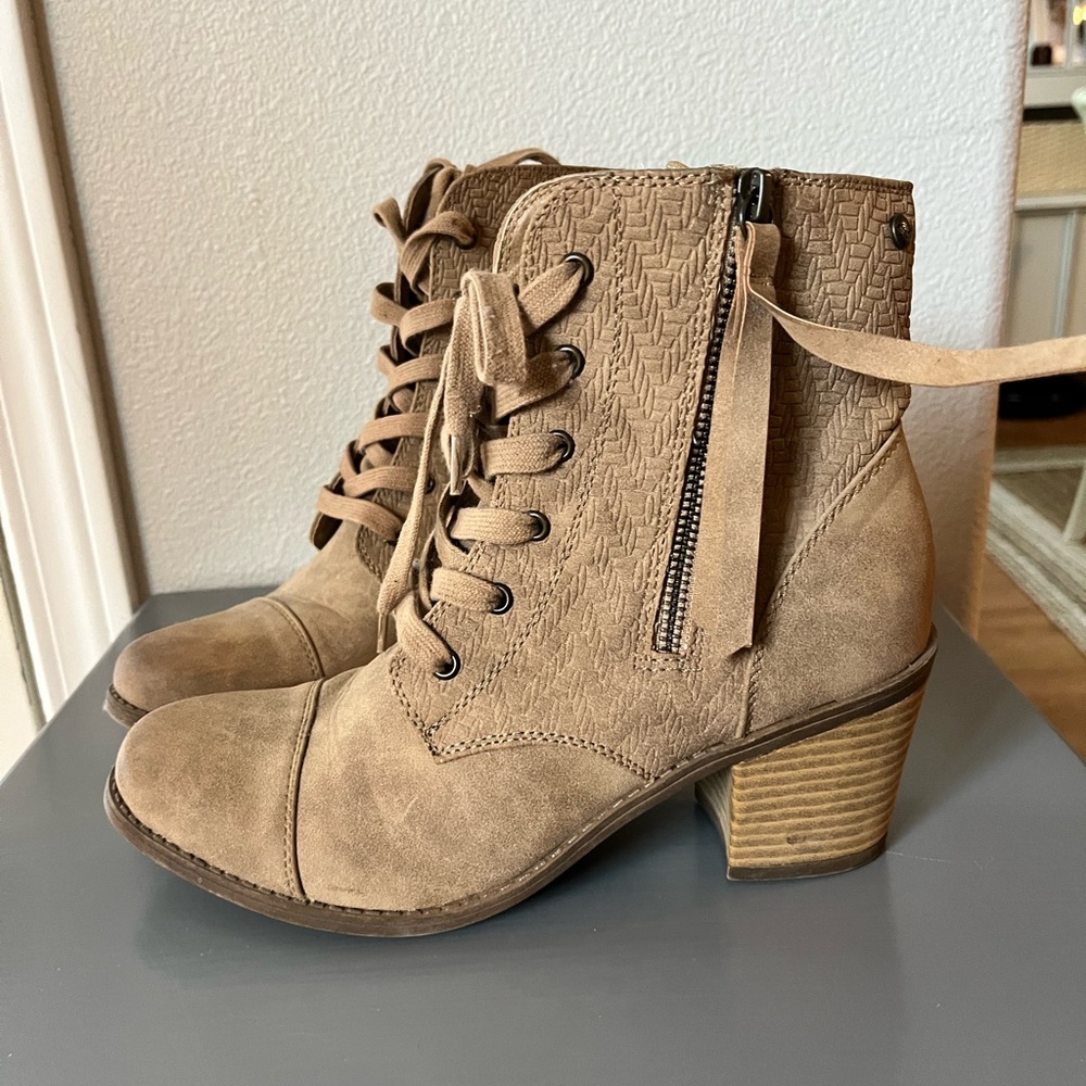 Tan lace-up combat boots with heel